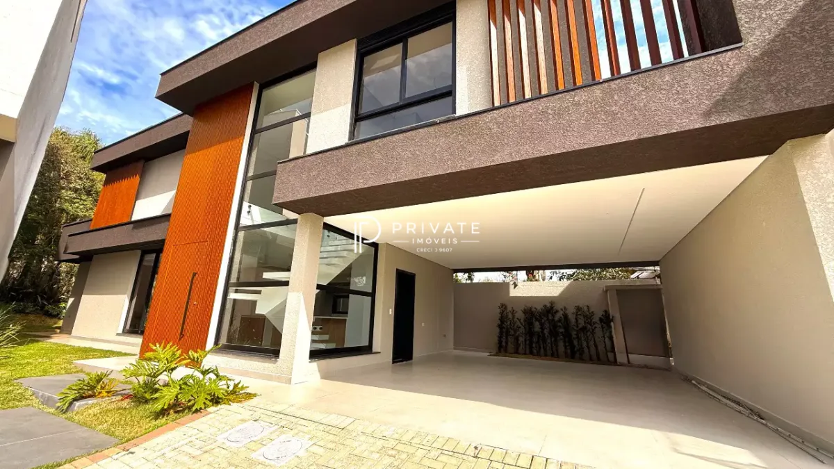 Casa contemporânea com arquitetura autoral, jardim privativo e 3 suítes